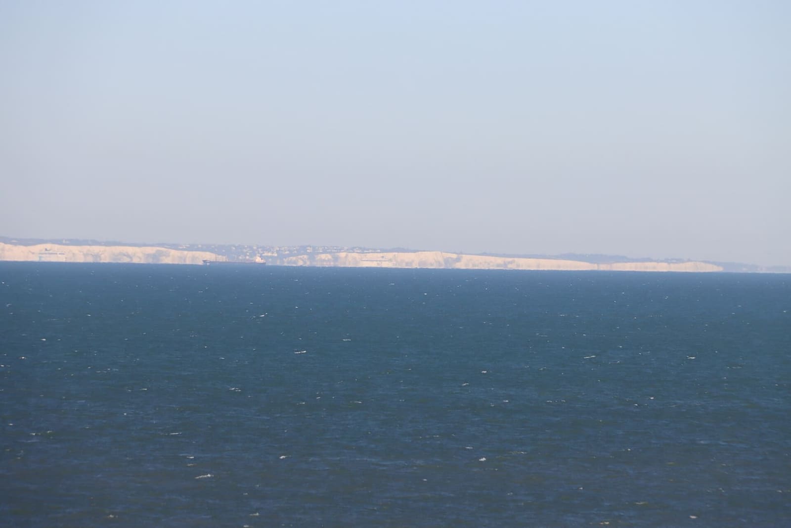 the white cliffs of Dover on the horizon, across the strait, from Gris-Nez