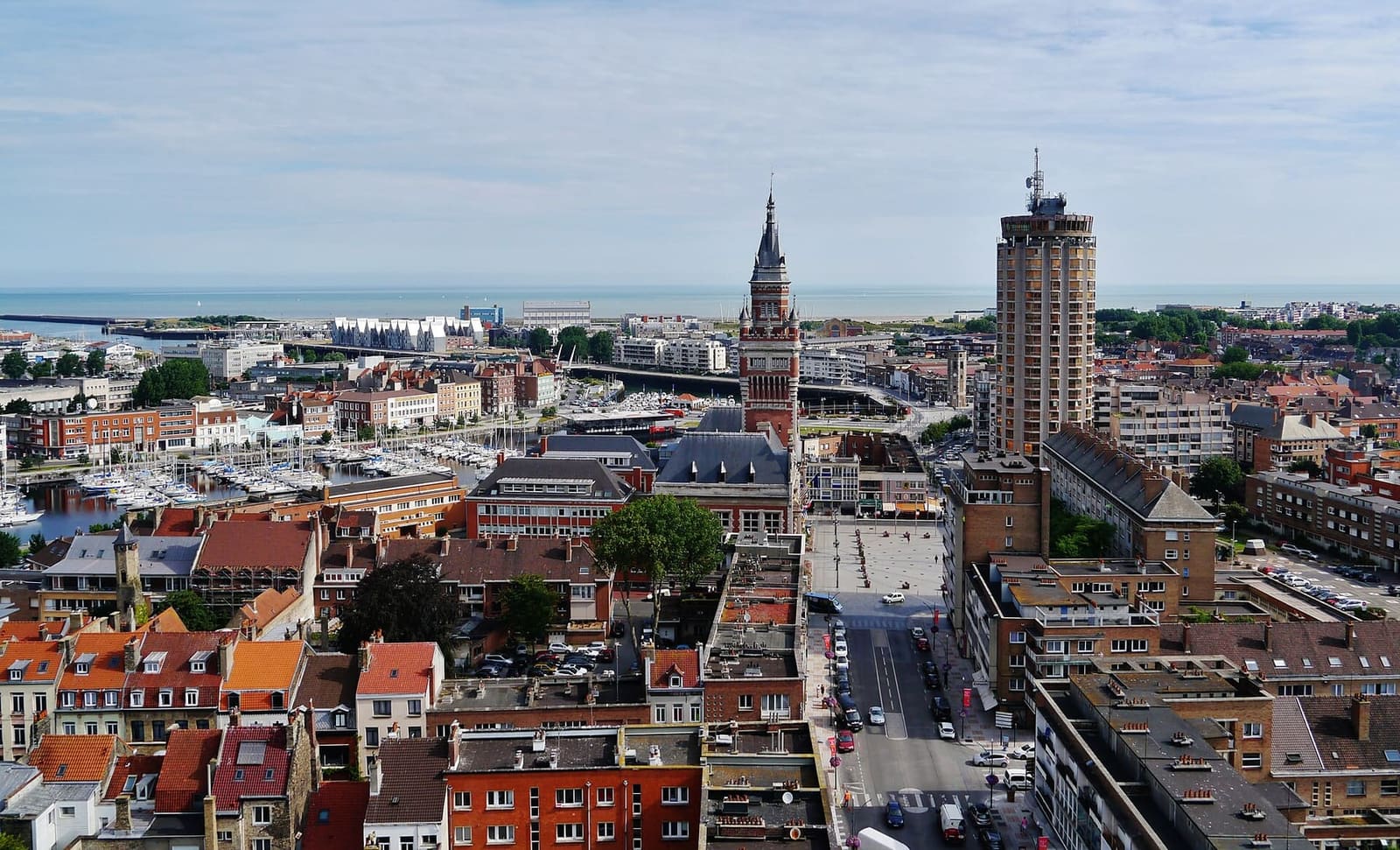 the town from the belfry terrace, with the town hall tower, the port and the sea beyond