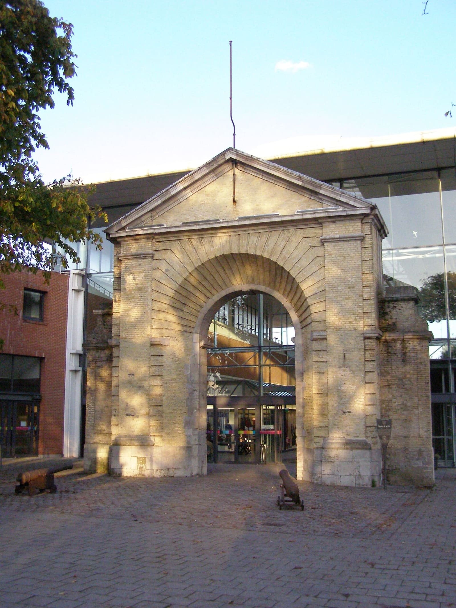 the 17th-century Porte de la Marine, the old entrance to the arsenal, in the evening light