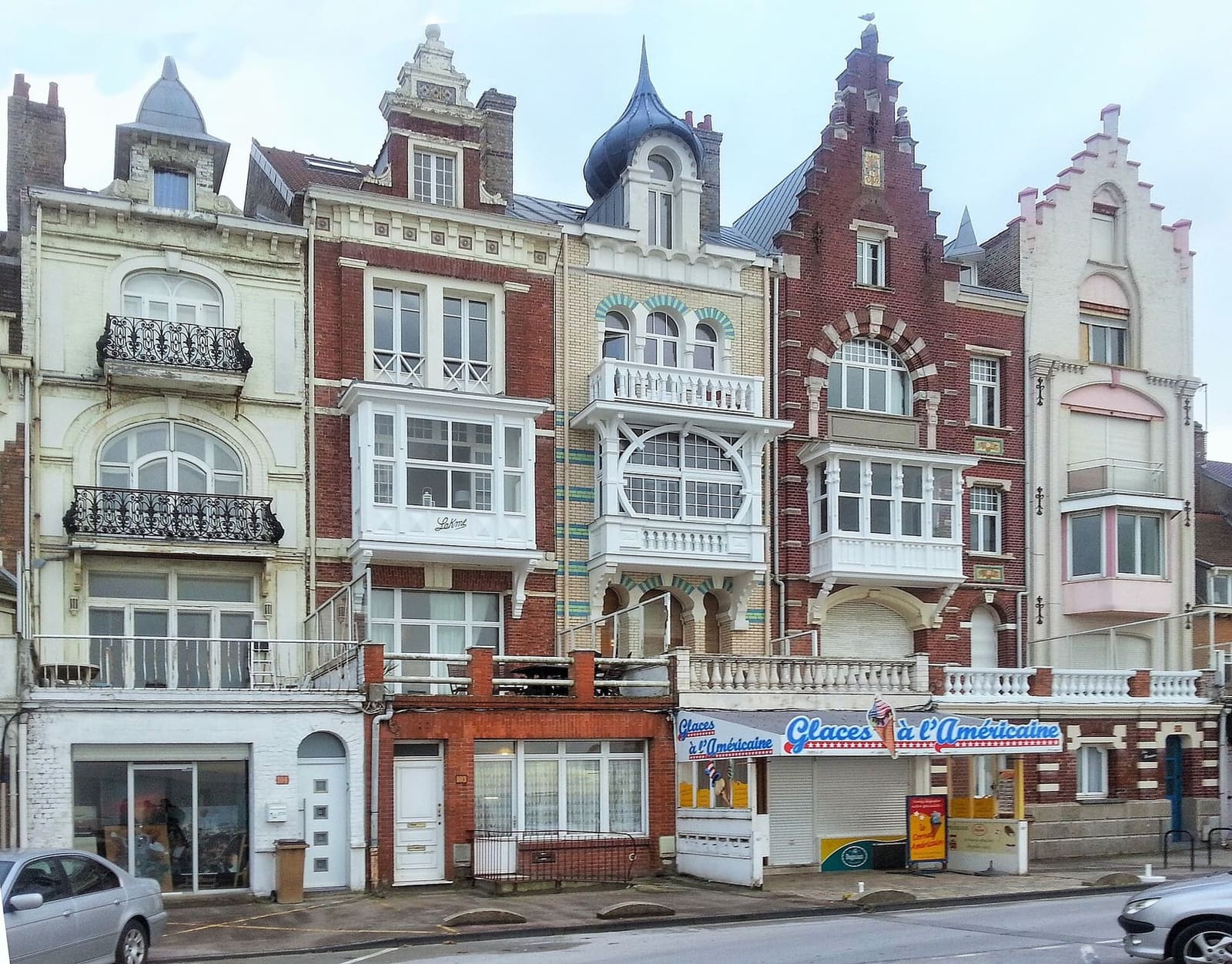 a row of Belle Époque villas in Malo-les-Bains, with stepped gables, spires and bay windows