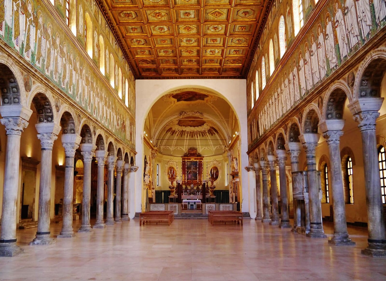 the nave of Sant'Apollinare Nuovo with the two bands of mosaics above the columns