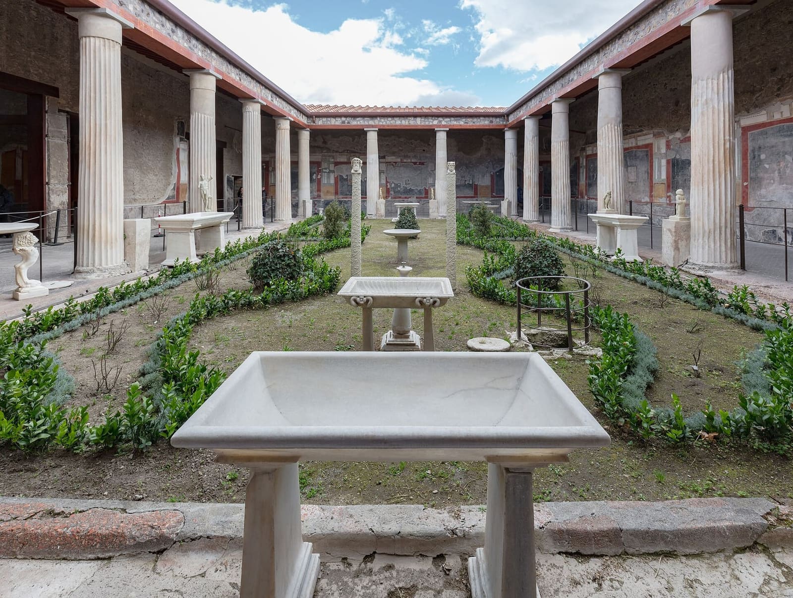 the peristyle of the Casa dei Vettii, with the garden, the marble basins and the columns, in March