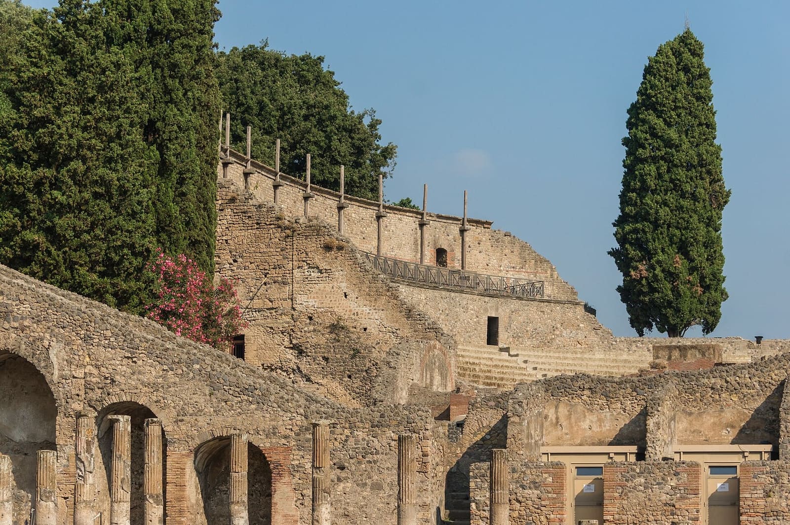 the seating of the theatre seen from the quadriporticus, among the cypresses