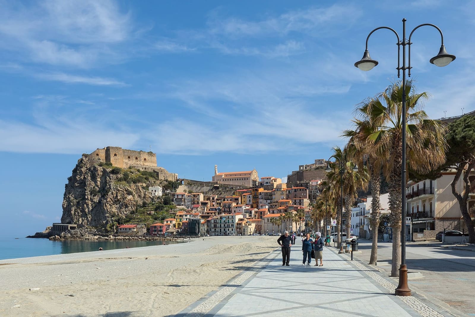 the seafront of Marina Grande with its palm trees, and the castle rock in the distance