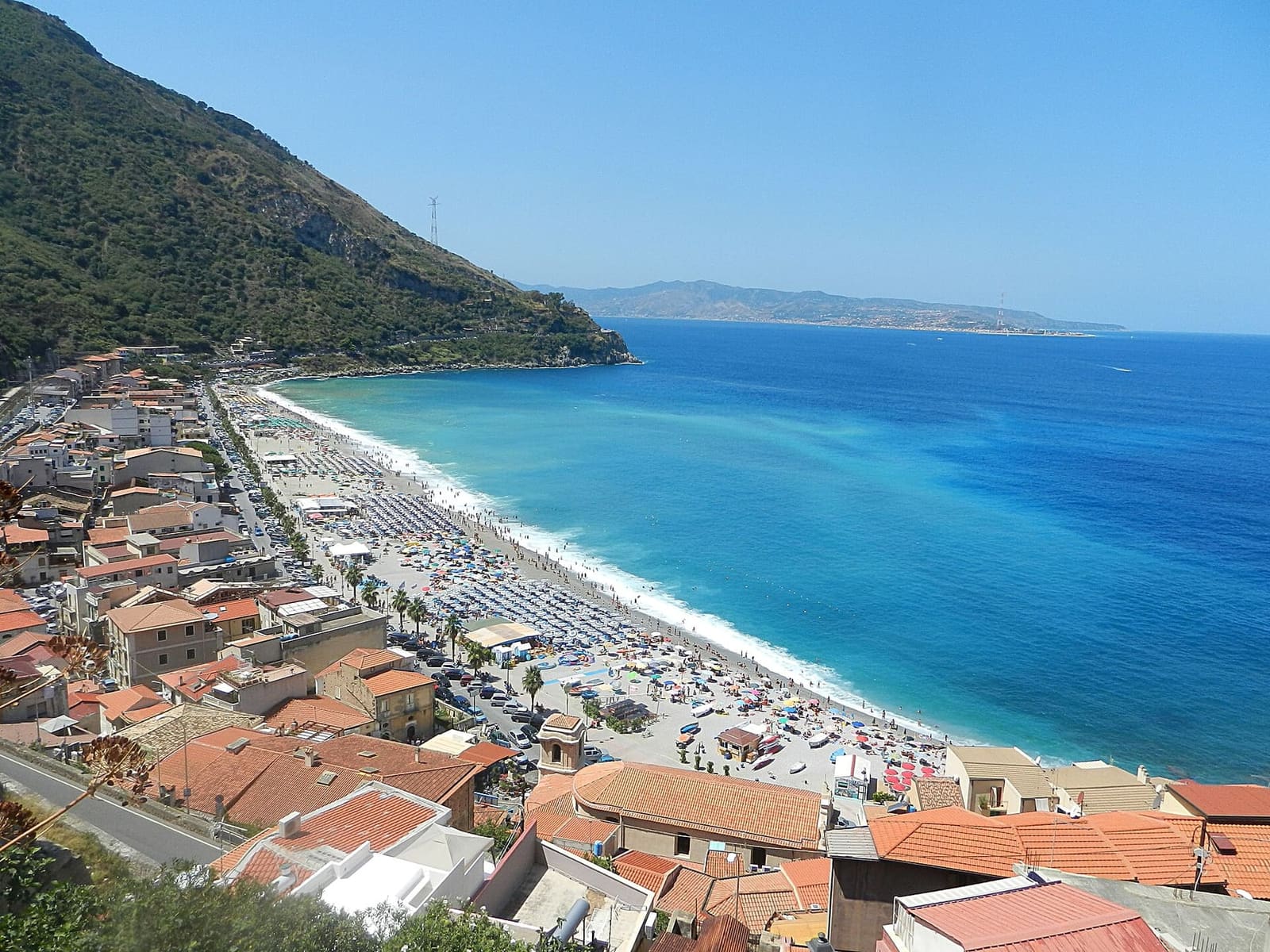 Marina Grande in summer seen from above, full of beach umbrellas