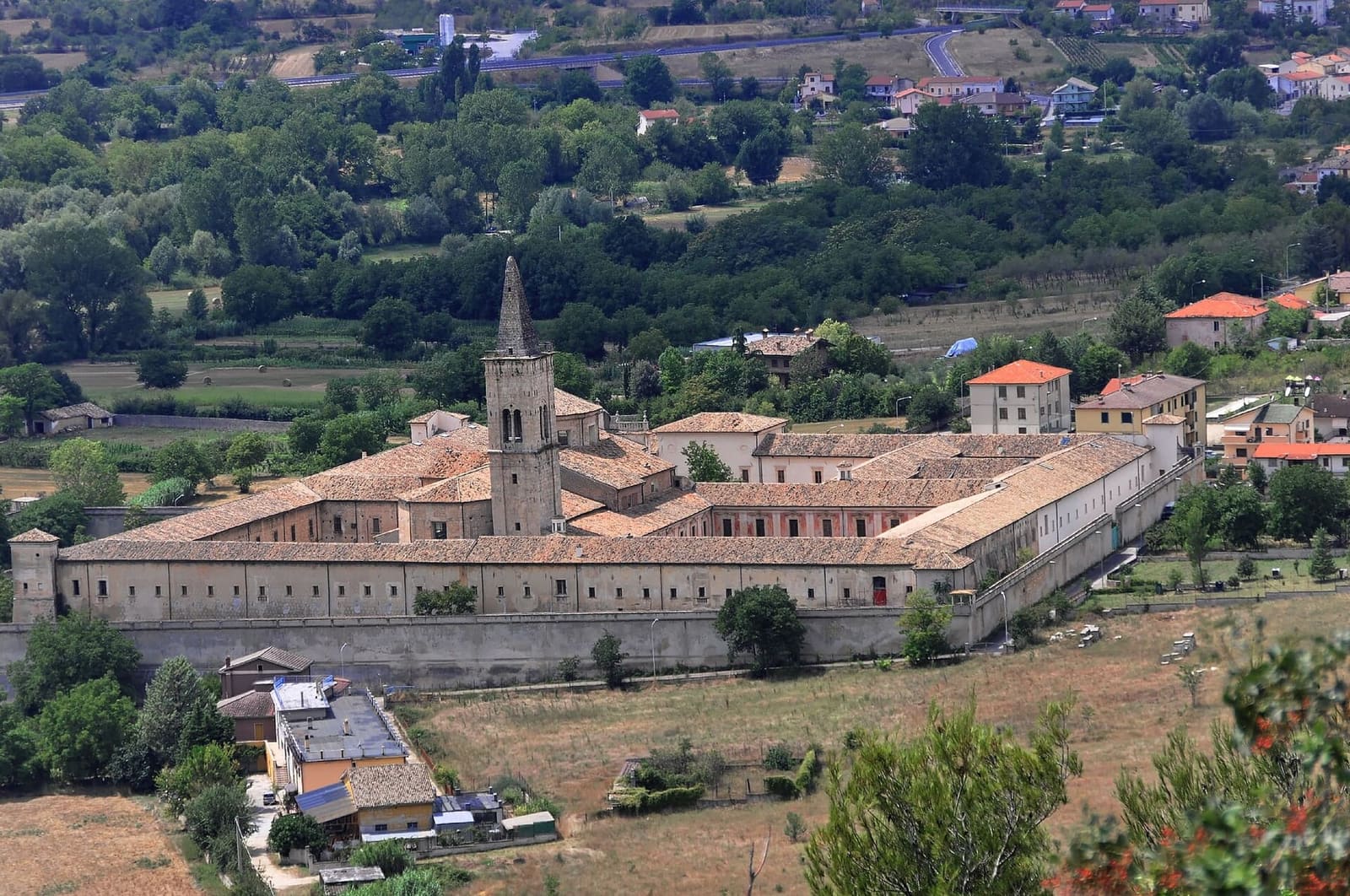the Badia Morronese seen from above, with the bell tower and the great courtyards in the basin
