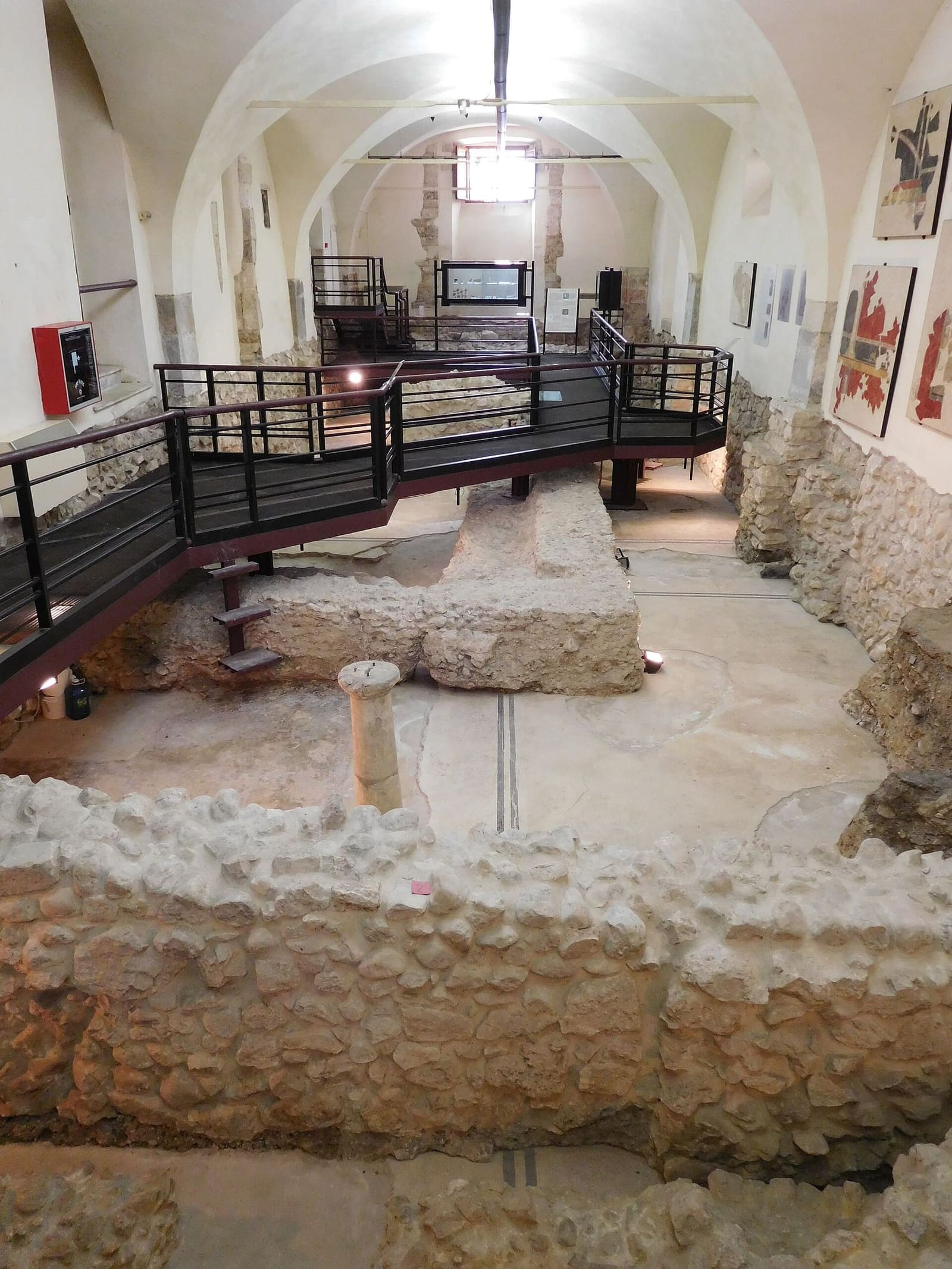 the domus of Ariadne below the palazzo of the Annunziata, with the walkway suspended over the excavations