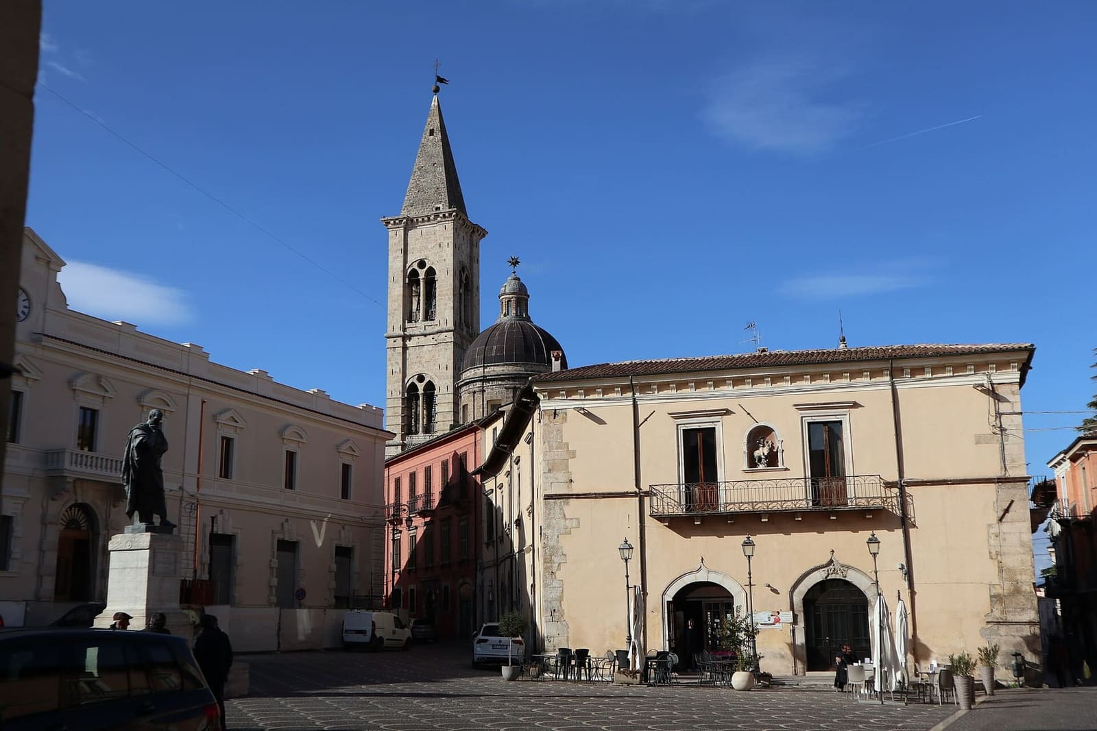 piazza XX Settembre with the statue of Ovid and the bell tower of the Annunziata